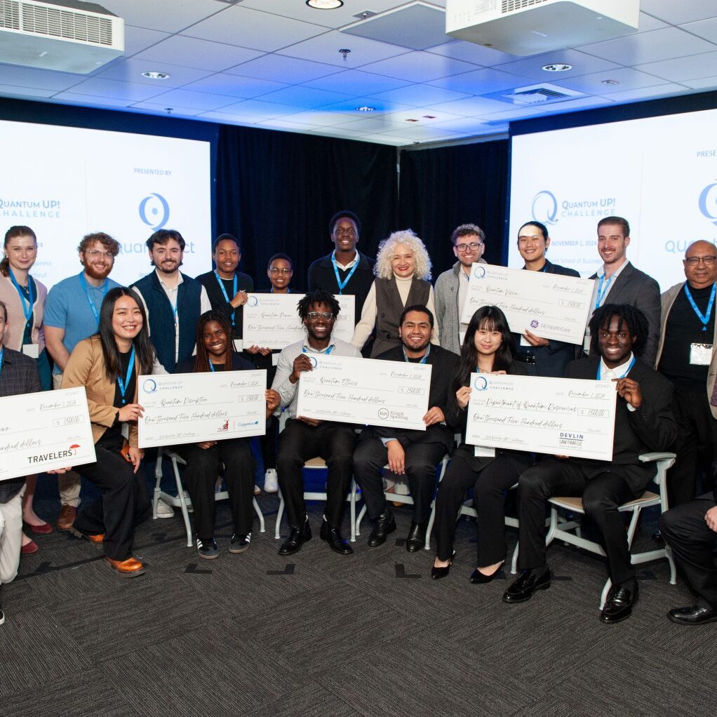 QuantumUP! winners, showing a group of students a part of the winning teams (holding large cheques), along with president Radenka Maric and other Univeristy / corporate leaders.